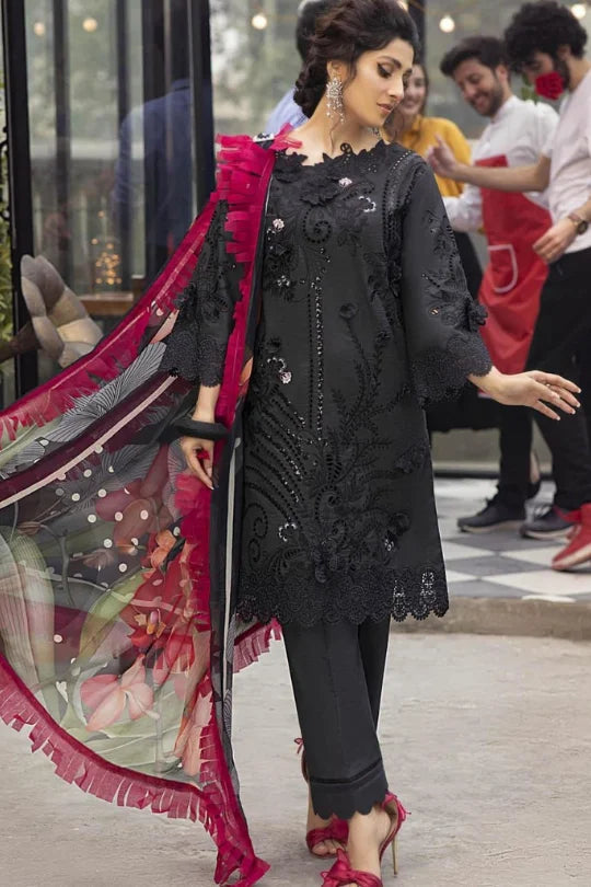 Elegant black outfit with detailed embroidery and vibrant dupatta, showcasing modern ethnic style and grace.