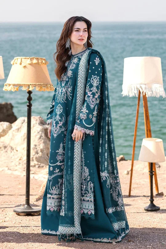 Gulfatima 3PC dress in teal with intricate embroidery, styled for summer elegance near the waterfront.