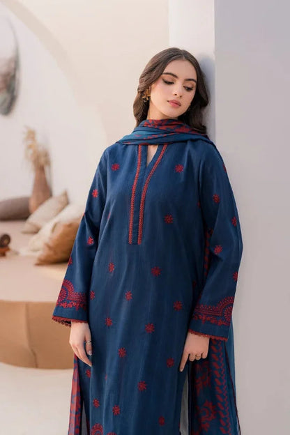 Elegant model showcasing a navy blue embroidered 3PC summer dress with matching dupatta and chic drapes.
