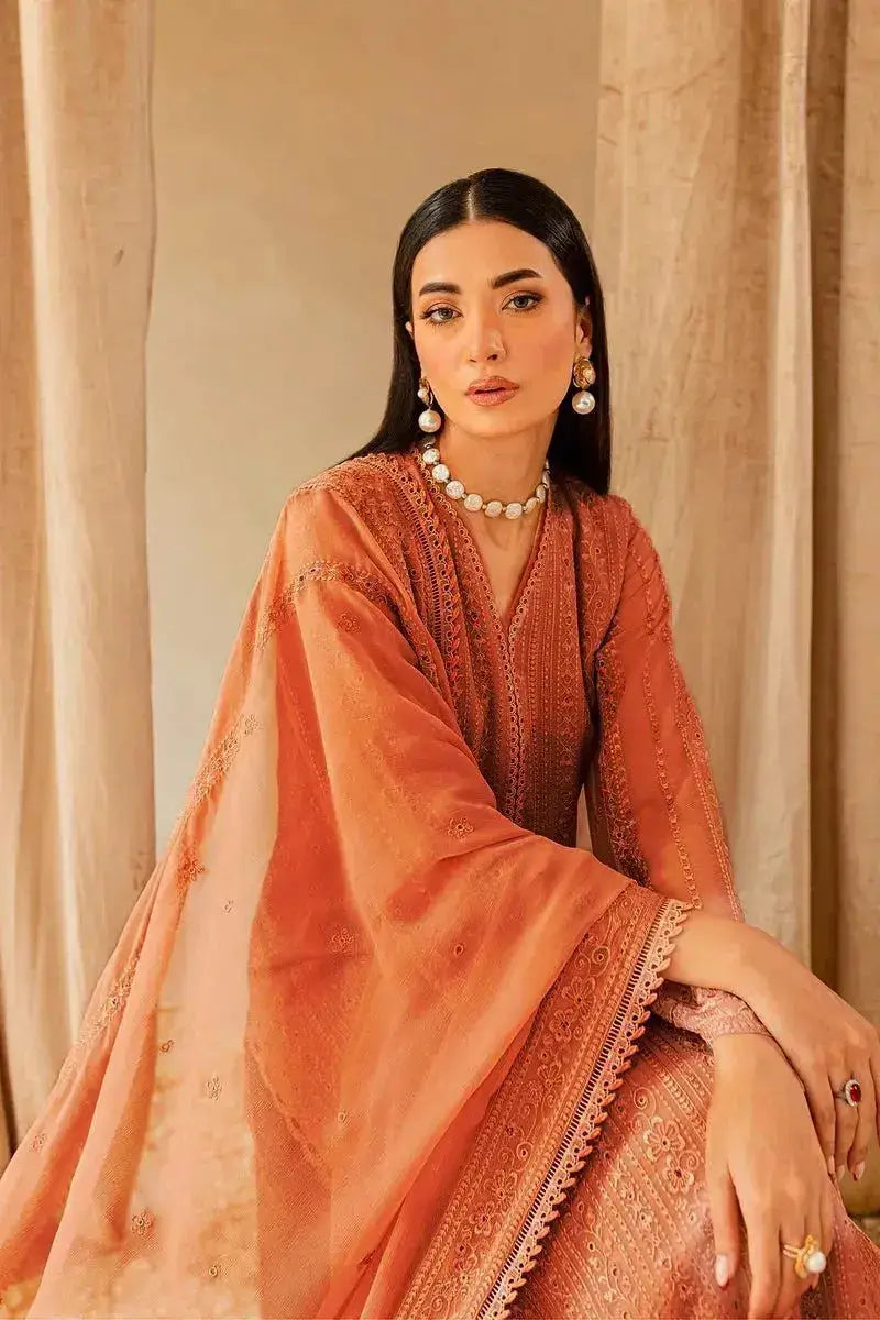 Elegant woman in a warm-toned outfit from the Winter Wedding Collection, showcasing luxury and grace.