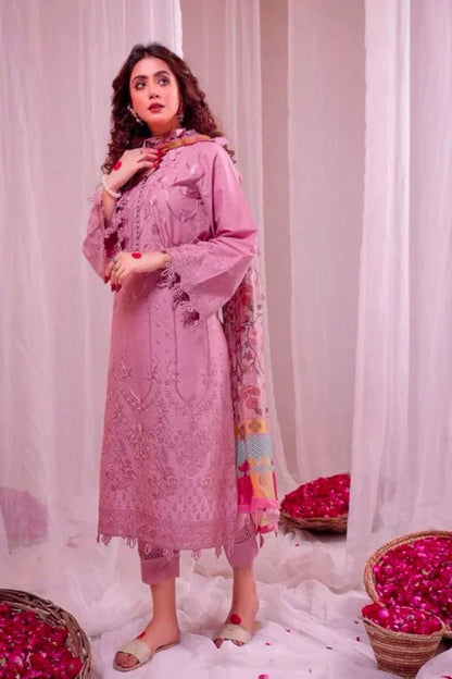 Elegant pink 3PC Pakistani dress with intricate embroidery, styled with a vibrant dupatta and graceful drape.